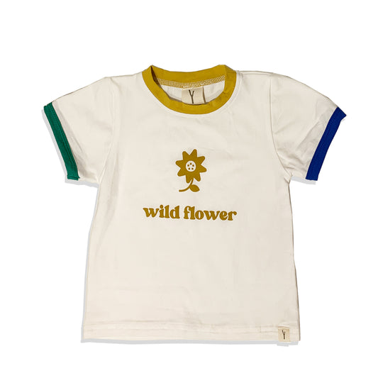 IVORY TEE SHIRT WITH PRINT IN GOLDEN COLOUR THAT SAYS WILD FLOWER AND A PRINT OF A DAISY